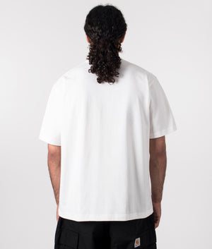 and wander logo t-shirt in white. Shot at EQVVS. Model reverse shot. 