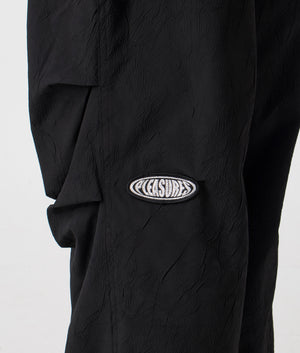 Root Flight Pants in Black by Pleasures. EQVVS Menswear Side Detail Model Shot. 