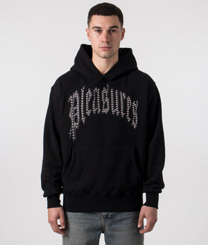 Relaxed Fit PLEASURES Twitch Studded Hoodie in Black. At EQVVS Menswear. Front model detail shot.