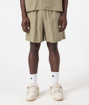 MKI Relaxed Fit Tencel Shorts in Sage Green. Front angle model shot at EQVVS.