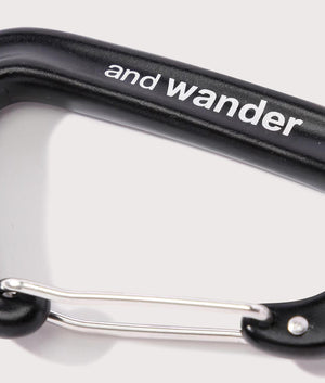 and wander Utility Carabiner in Black, Aluminium. At EQVVS Menswear. Side logo shot