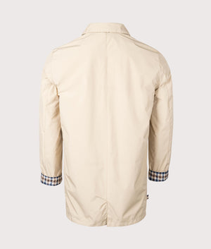 Active Packable Trench Coat in Beige by Aquascutum. EQVVS Back Angle Shot.