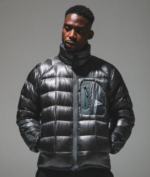 and wander diamond quilt padded jacket in grey. Shot at EQVVS. campaign shot.