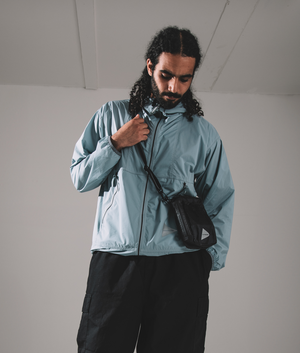 Nylon pertex jacket in light blue by and wander. shot at EQVVS. campaign shot. 