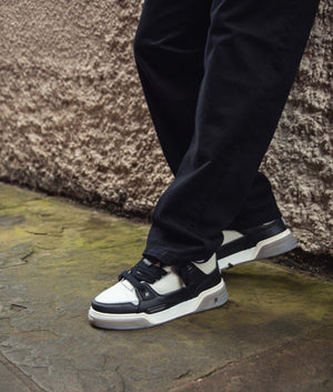 Studio Sneakers in Black & Vintage White by Represent. EQVVS Shot.