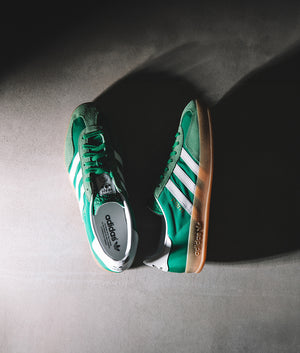 adidas Originals Gazelle Indoor Trainers in Green/Footwear White/Hazy Green at EQVVS. campaign shot. 