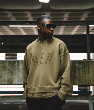 Campaign Shot Rep Applique Sweatshirt in Fawn by Represent. EQVVS Model Shot. 