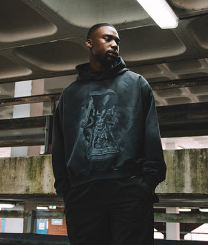 Campaign Image Atlas Hoodie in Stained Black by Represent with chest and back print. EQVVS Model Shot. 