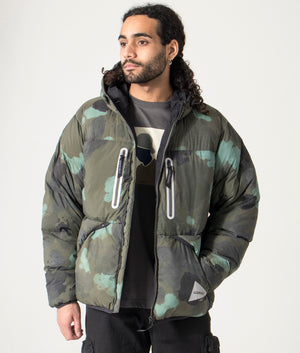 Gramicci x and wander down jacket - camo. Model shot at EQVVS. 