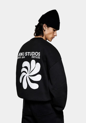 MKI Miyuki Zoku Abstract Crewneck Sweatshirt in Black. Shot at EQVVS. Back Model Shot. 