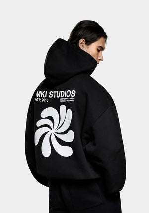 MKI Miyuki Zoku Abstract Hoodie in Black. Shot at EQVVS. Back Model Shot. 