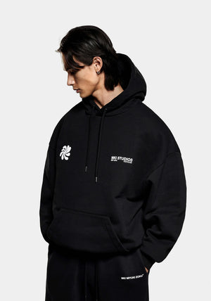 MKI Miyuki Zoku Abstract Hoodie in Black. Shot at EQVVS. Model Front Shot. 