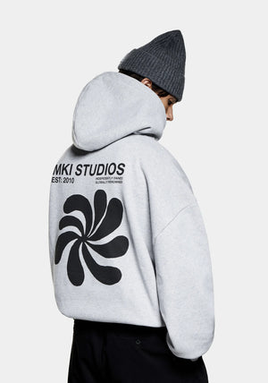 MKI Miyuki Zoku Abstract Hoodie in Grey. Shot at EQVVS. Model back shot. 