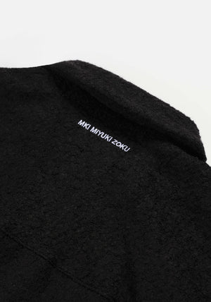 MKI Miyuki Zoku Boucle Overshirt in black. detail shot. 