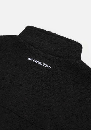 MKI Miyuki Zoku Black Boucle Quarter Zip Jumper Flat shot. 