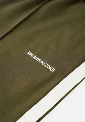 MKI Miyuki Zoku Olive Wide Fit Track Pants.  Detail shot. 