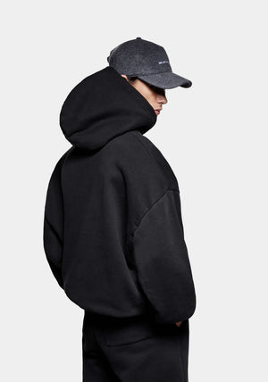 MKI Miyuki Zoku Linear Hoodie in Black. Shot at EQVVS. Back shot model. 