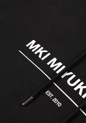 MKI Miyuki Zoku Linear Hoodie in Black. Shot at EQVVS. Detail shot. 