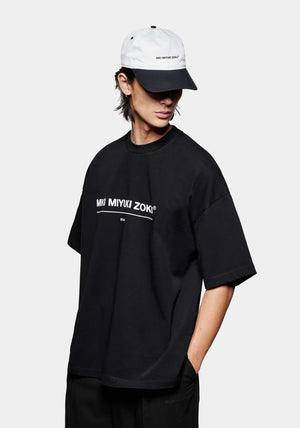 MKI Miyuki Zoku Linear T-Shirt in Black. Shot at EQVVS. Model front shot. 