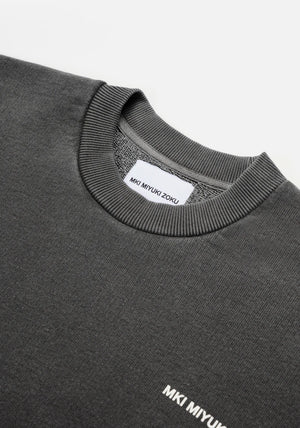 MKI Miyuki Zoku Uniform Crew Sweatshirt in Pigment Black. Shot at EQVVS.  Detail shot. 