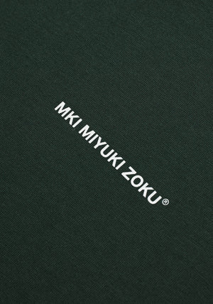 MKI Miyuki Zoku Long Sleeve Uniform T-Shirt in Green. Shot at EQVVS. Detail shot. 