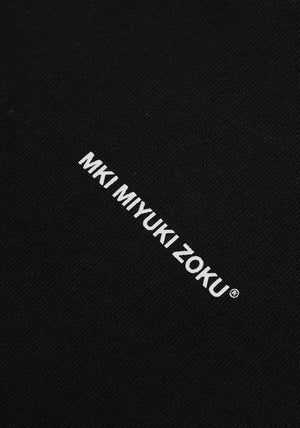 MKI Miyuki Zoku Uniform Zip Through Hoodie in Black. Shot at EQVVS. Detail shot. 