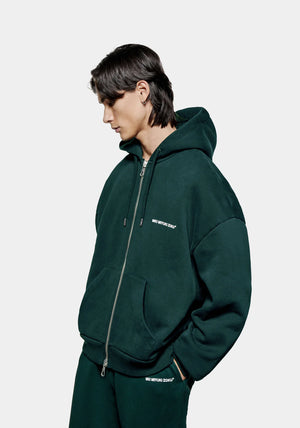 MKI Miyuki Zoku Uniform Zip Through Hoodie in Green. Shot at EQVVS. Model front shot. 