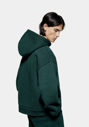 MKI Miyuki Zoku Uniform Zip Through Hoodie in Green. Shot at EQVVS.  Model back shot. 