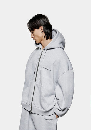 MKI Miyuki Zoku Uniform Zip Through Hoodie in Grey. Shot at EQVVS.  Model front shot. 