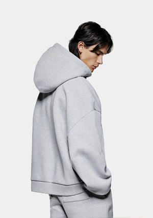 MKI Miyuki Zoku Uniform Zip Through Hoodie in Grey. Shot at EQVVS. Model reverse shot. 