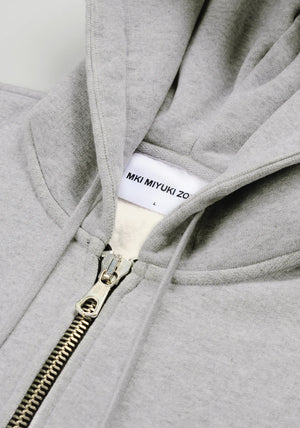 MKI Miyuki Zoku Uniform Zip Through Hoodie in Grey. Shot at EQVVS. Detail shot. 