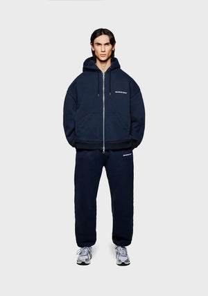 MKI Miyuki Zoku Uniform Zip Through Hoodie in Navy. Shot at EQVVS.  Full length shot. 