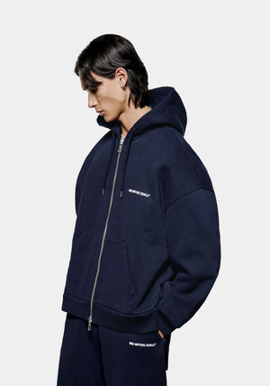 MKI Miyuki Zoku Uniform Zip Through Hoodie in Navy. Shot at EQVVS. Front model shot. 