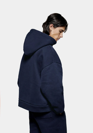 MKI Miyuki Zoku Uniform Zip Through Hoodie in Navy. Shot at EQVVS. Model back shot. 