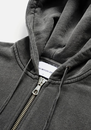 MKI Miyuki Zoku Uniform Zip Through Hoodie in Pigment Black. Shot at EQVVS.  Detail shot. 