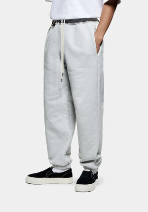 MKI Miyuki Zoku Superweight Joggers in Grey, shot at EQVVS. Side angle. 