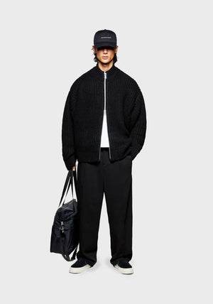 MKI Miyuki Zoku Chunky Rib Knit Track Jacket in Black at EQVVS. Model Front Shot.