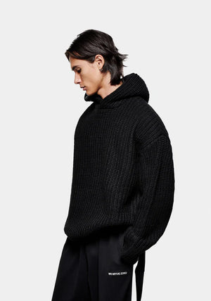 Chunky Rib Knit Hoodie in Black by MKI MIYUKI ZOKU at EQVVS Menswear. Side Model Shot. 