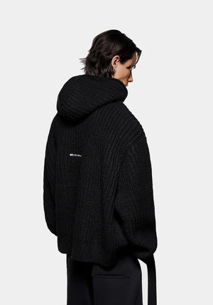 Chunky Rib Knit Hoodie in Black by MKI MIYUKI ZOKU at EQVVS Menswear. Side Model Shot. 