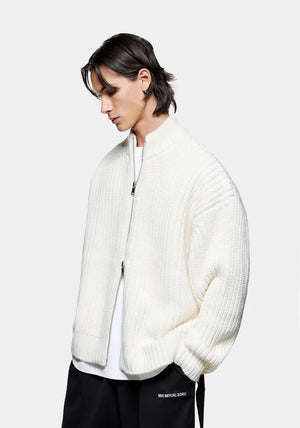 MKI Miyuki Zoku Chunky Rib Knit Track Jacket in Off White at EQVVS. Model Angle Shot.