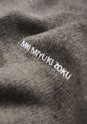 MKI MIYUKI ZOKU Mohair Blend Knit Track Jacket in Brown Marl at EQVVS Menswear.Detail Logo Shot. 