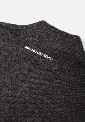 Mohair Blend Knit Track Jacket in Charcoal by MKI MIYUKI ZOKU at EQVVS Menswear. Logo Detail Shot. 