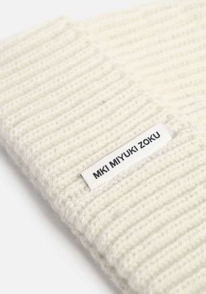 MKI Miyuki Zoku Off White Cashmere Ribbed Beanie at EQVVS Menswear. Detail shot. 