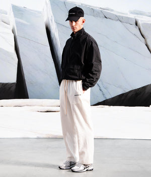 Relaxed Fit Seersucker Trousers In Off White by MKI MIYUKI ZOKU. EQVVS Campaign Shot. 