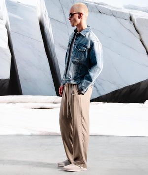 Relaxed Fit Tencel Trousers in Sage Green by MKI MIYUKI ZOKU. EQVVS Campaign Shot. 