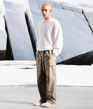 Relaxed Fit Ripstop Cargo Pants in Sage Green by MKI MIYUKI ZOKU. EQVVS Campaign Shot.