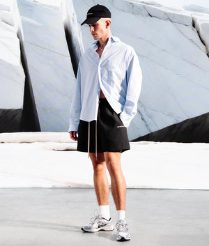 Relaxed Fit Seersucker Shorts in Black by MKI MIYUKI ZOKU. EQVVS Campaign Shot.