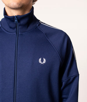 Fred Perry Taped Sleeve Track Top in Blue at EQVVS. Detail Shot. 